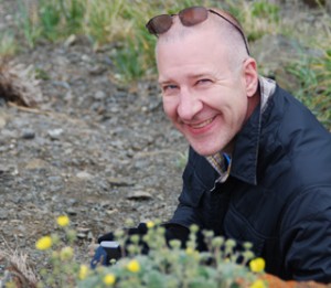 Reeves photographing flowers in Alaska